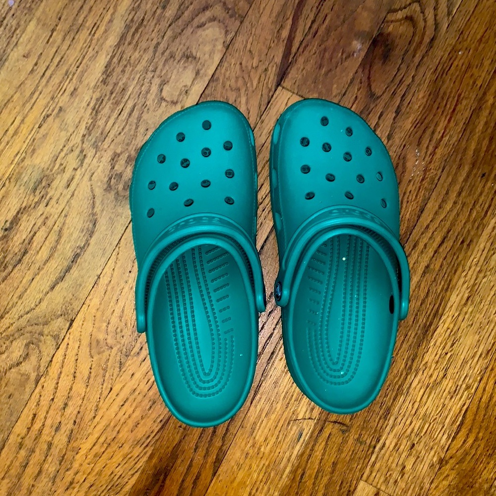Used Womens deep green Crocs size 9 (mens 7)